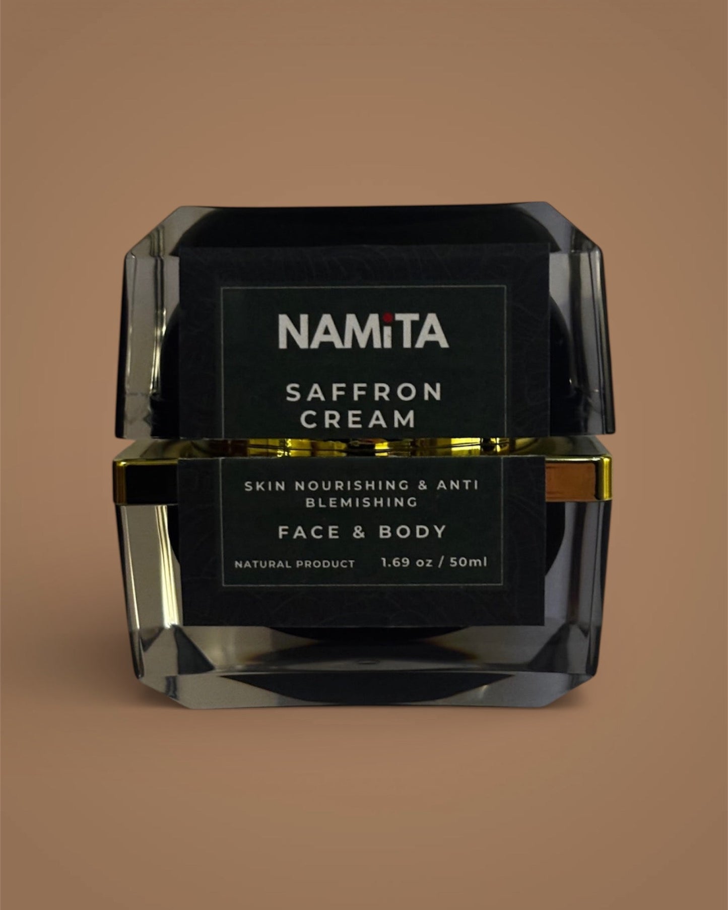 Black jar of Namita Saffron Cream on a brown background