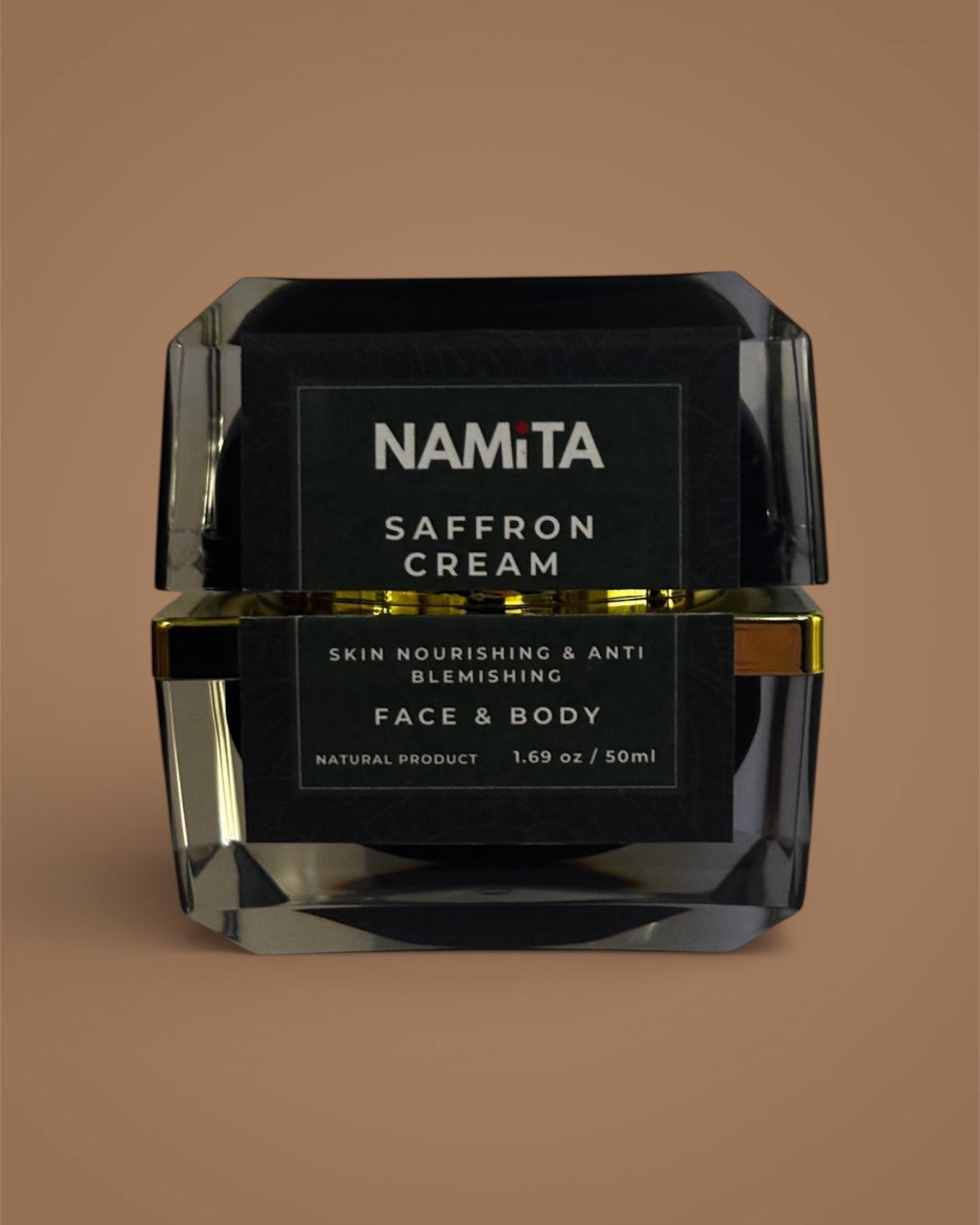 Black jar of Namita Saffron Cream on a brown background